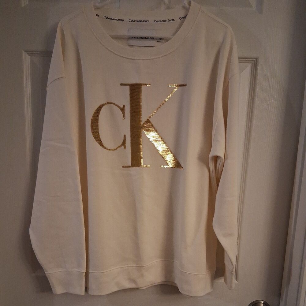 New Calvin Kline Jeans  and Women  Cream Sequin Pullover In Gold Letter CK